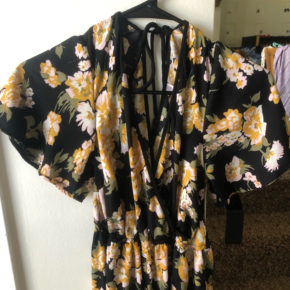 Black romper with yellow flowers and open back